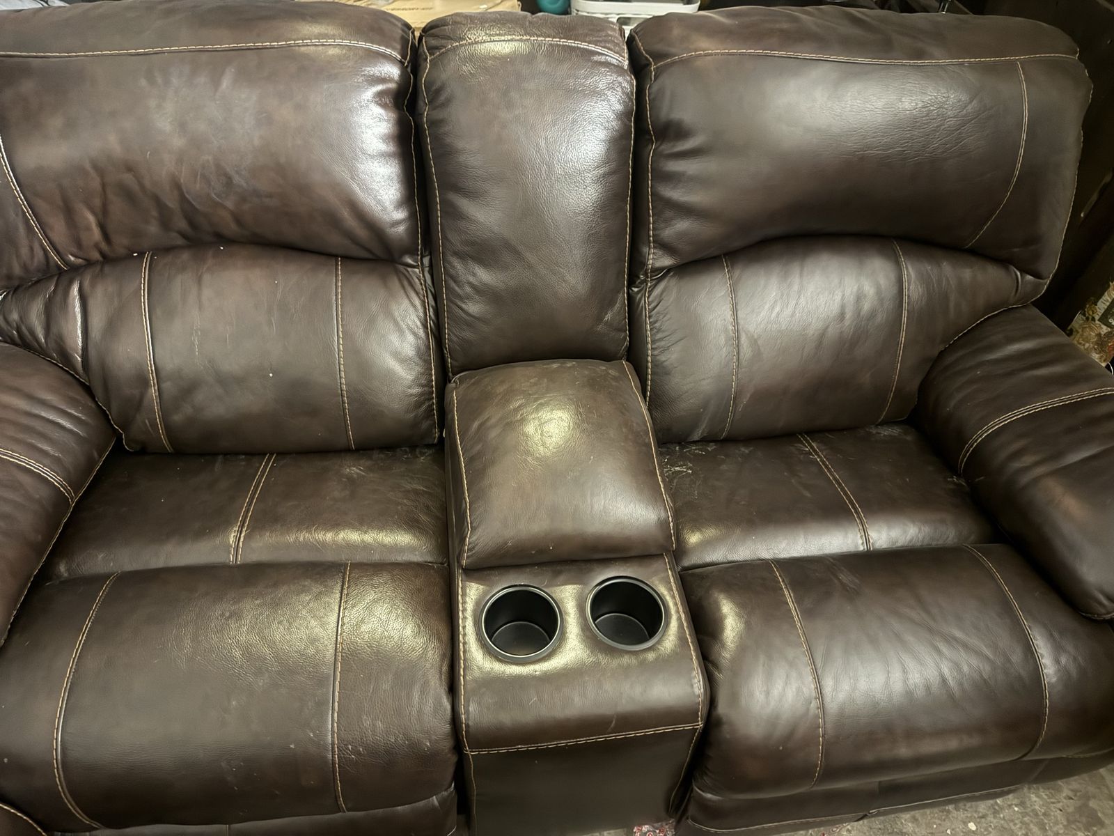 Dark Brown Leather electric Reclining sofas one with Center Console and Cupholders