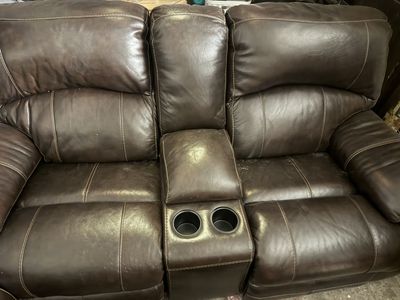 Dark Brown Leather electric Reclining sofas one with Center Console and Cupholders