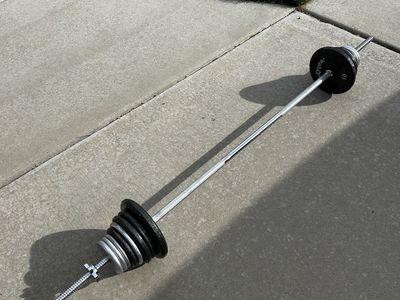 80 Pounds of Plate Weights Plus 5 Pound Bar