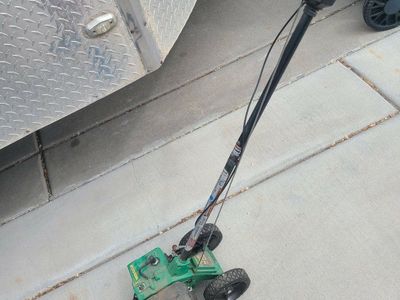Gas powered lawn edger with blade