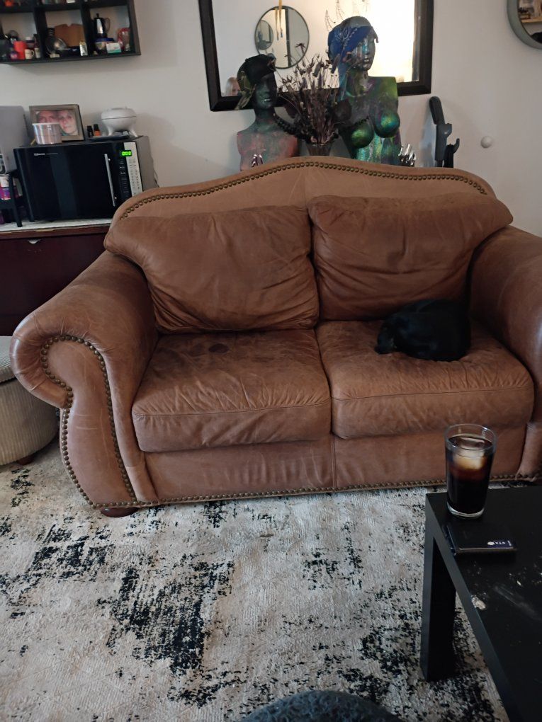 brown leather sofa/loveseat