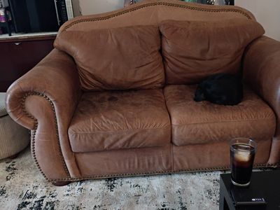 brown leather sofa/loveseat