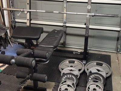 Bench and 244 pounds of weights