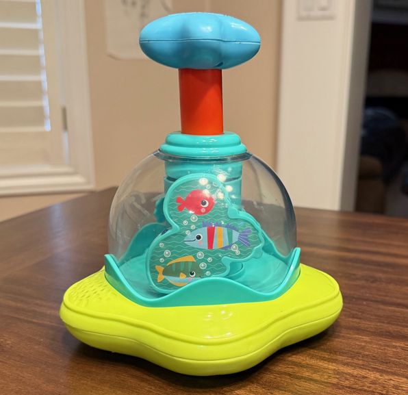 Bright Starts Press and Glow Infant Child Spinner Toy