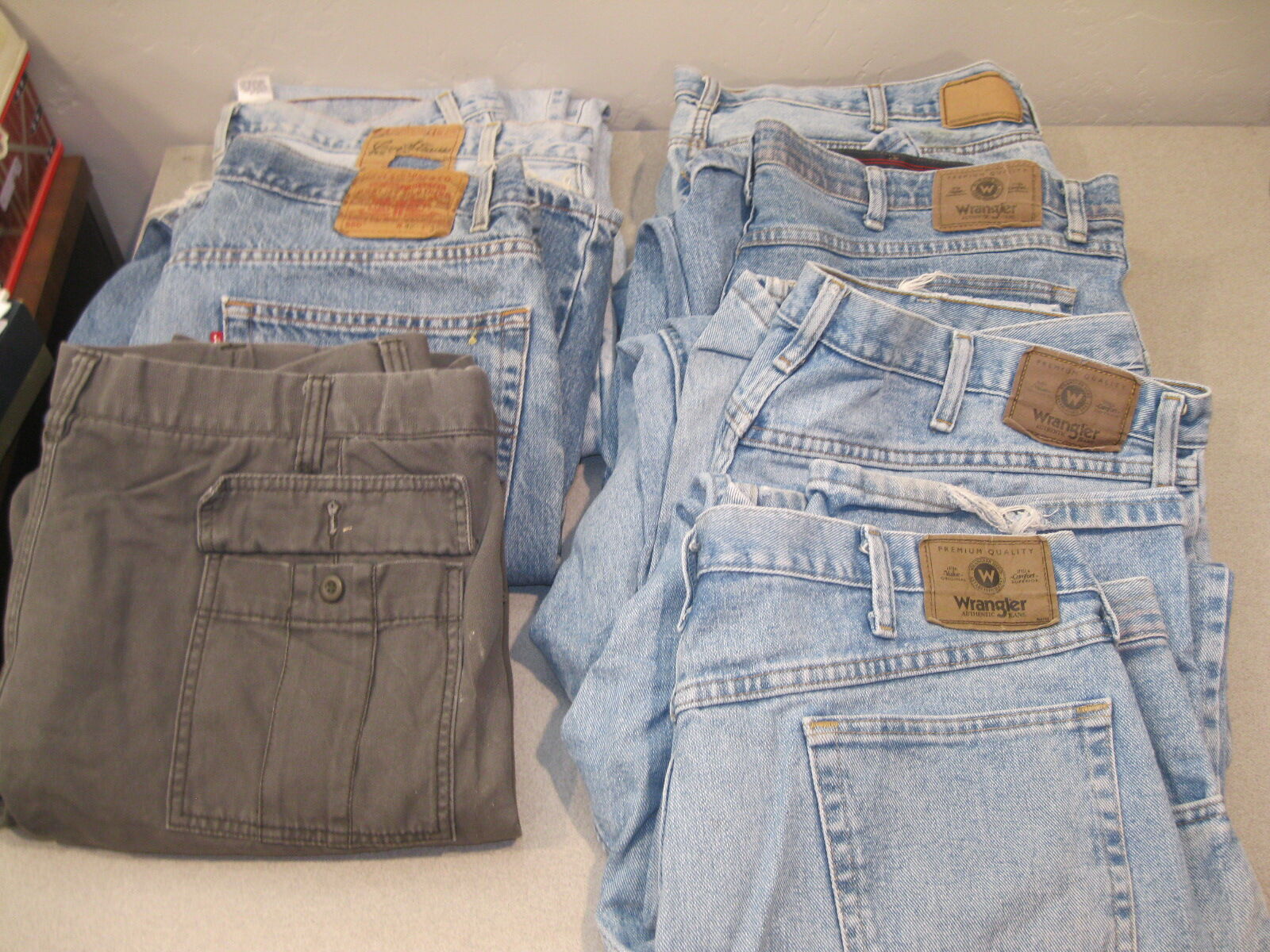7 Pair Of Wrangler, Levi's, Dockers, And Urban Pipeline Jeans