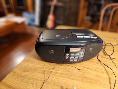 ONN boom box with Radio, CD, Tape, and Auxiliarry input. Everything works great.