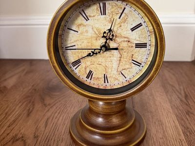 Clock for table or mantle 8.5 inches high and 6 inches wide - Hardely used excellent condition.