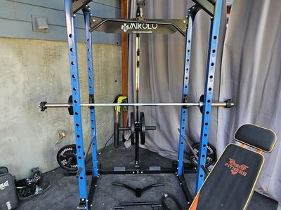 Mikolo Weight Rack w/ 265 lbs 2 inch Standard weights, 7 ft standard bar, and adjustable weight bench