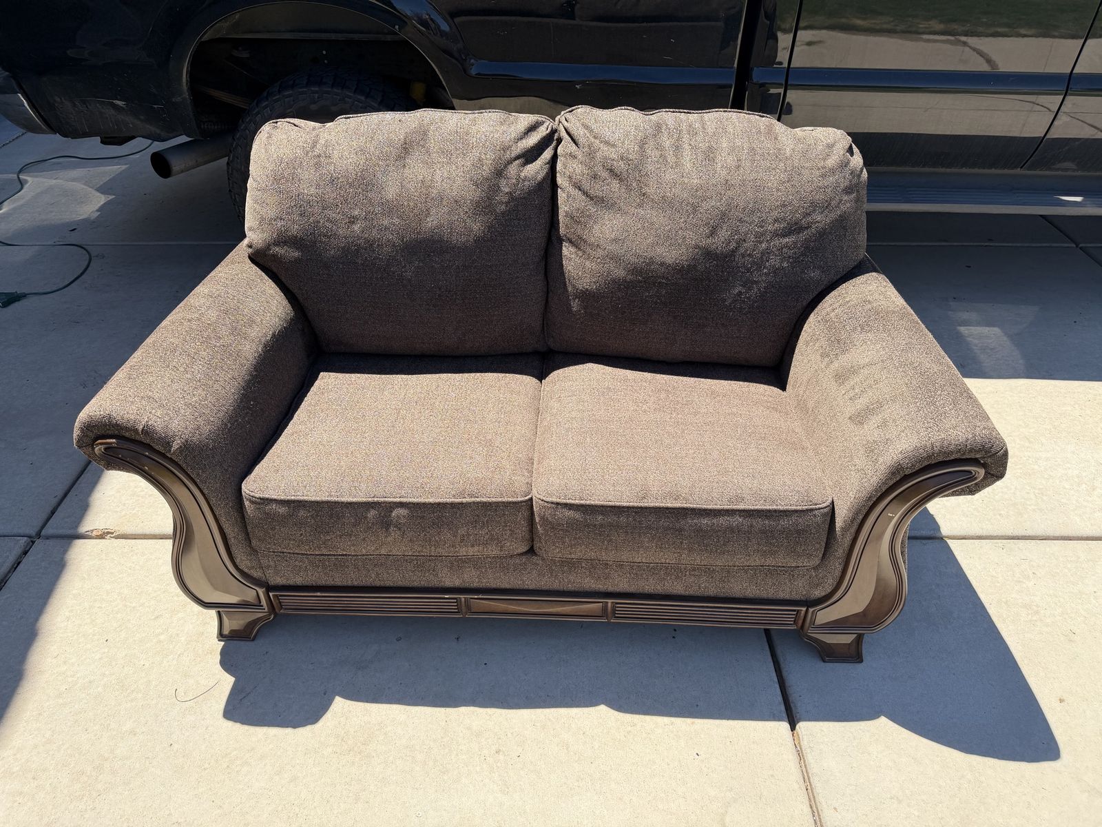 Cozy Brown Upholstered Loveseat with Wood Trim - Compact 2-Seater Sofa