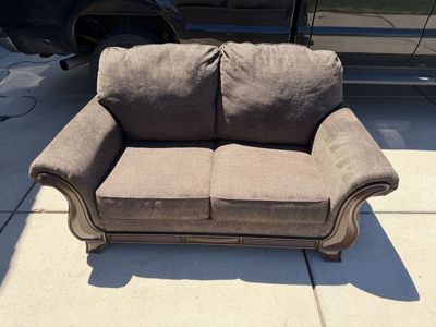 Cozy Brown Upholstered Loveseat with Wood Trim - Compact 2-Seater Sofa