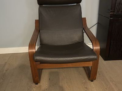Two IKEA Poange Dark Brown Leather Accent Armchair with Bentwood Frame. Unusual in leather. One Poange in dark fabric.