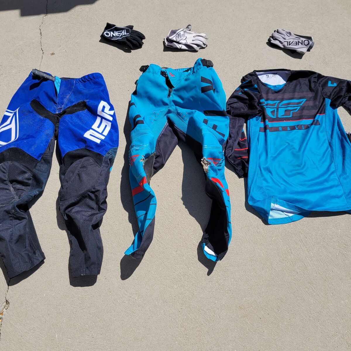 Fly Pants Size 30, Fly Jersey Size Medium, MSR Pants Size 30 and (3) sets of Oneal gloves size Medium