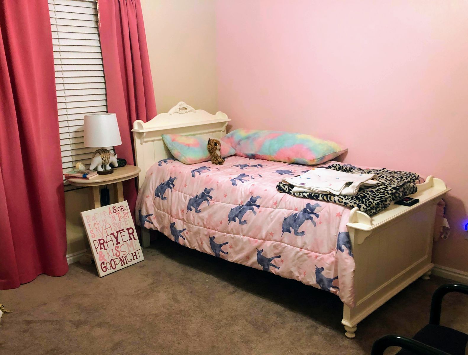 Classic White twin-sized bed frame and mattresses with embellishments