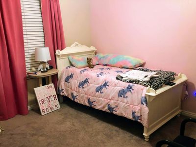 Classic White twin-sized bed frame and mattresses with embellishments