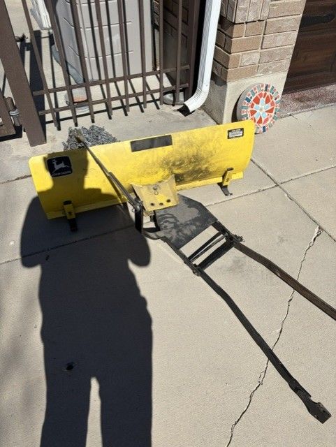 John Deere plowblade and tire chains