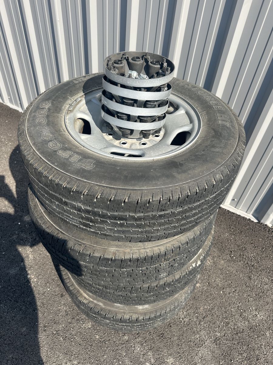 Four tires and rims off of factory 2023 GMC 2500.
