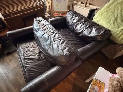 2 hideaway leather loveseats