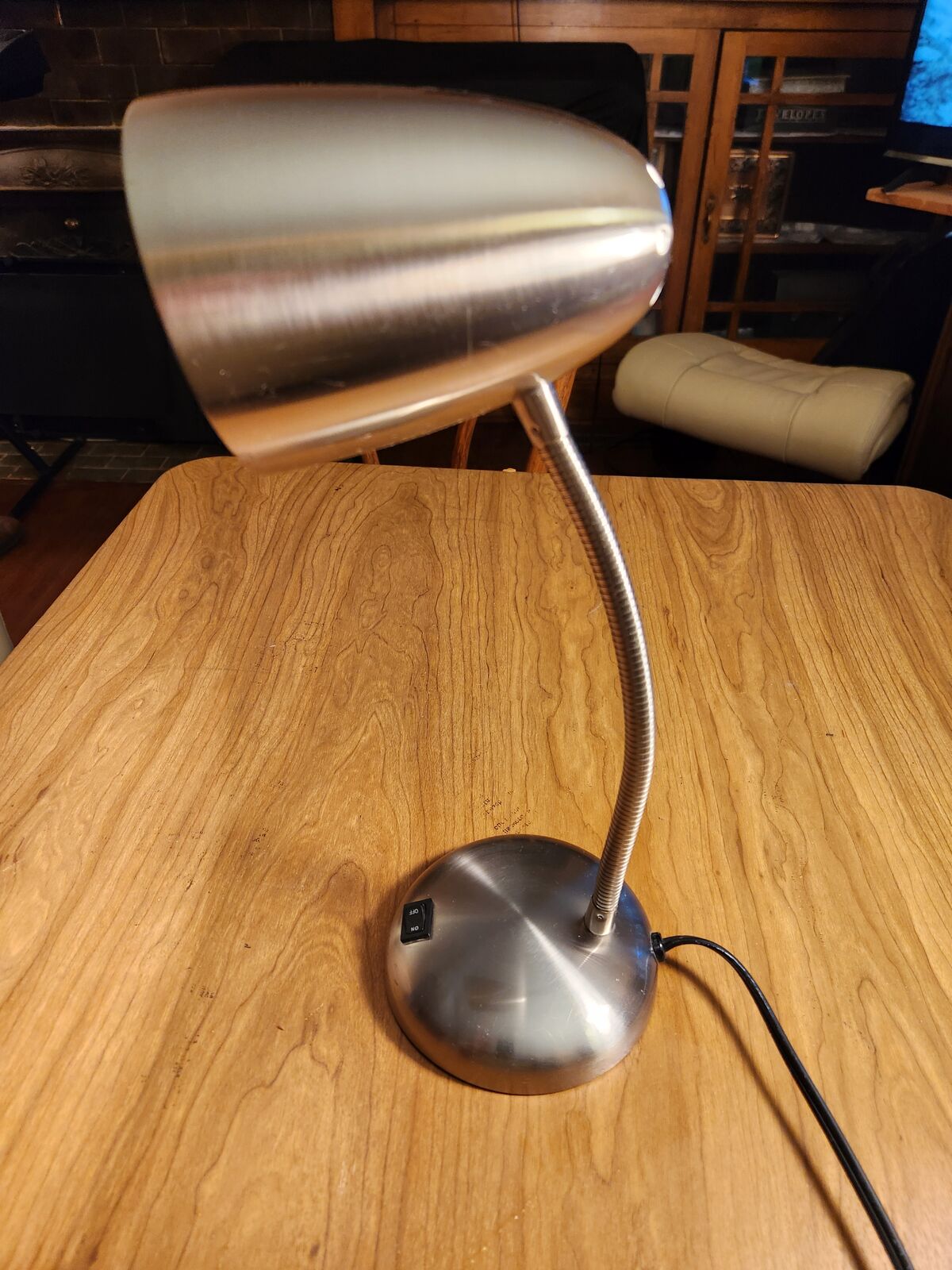 Little silver desk lamp.  Bendable neck works great.