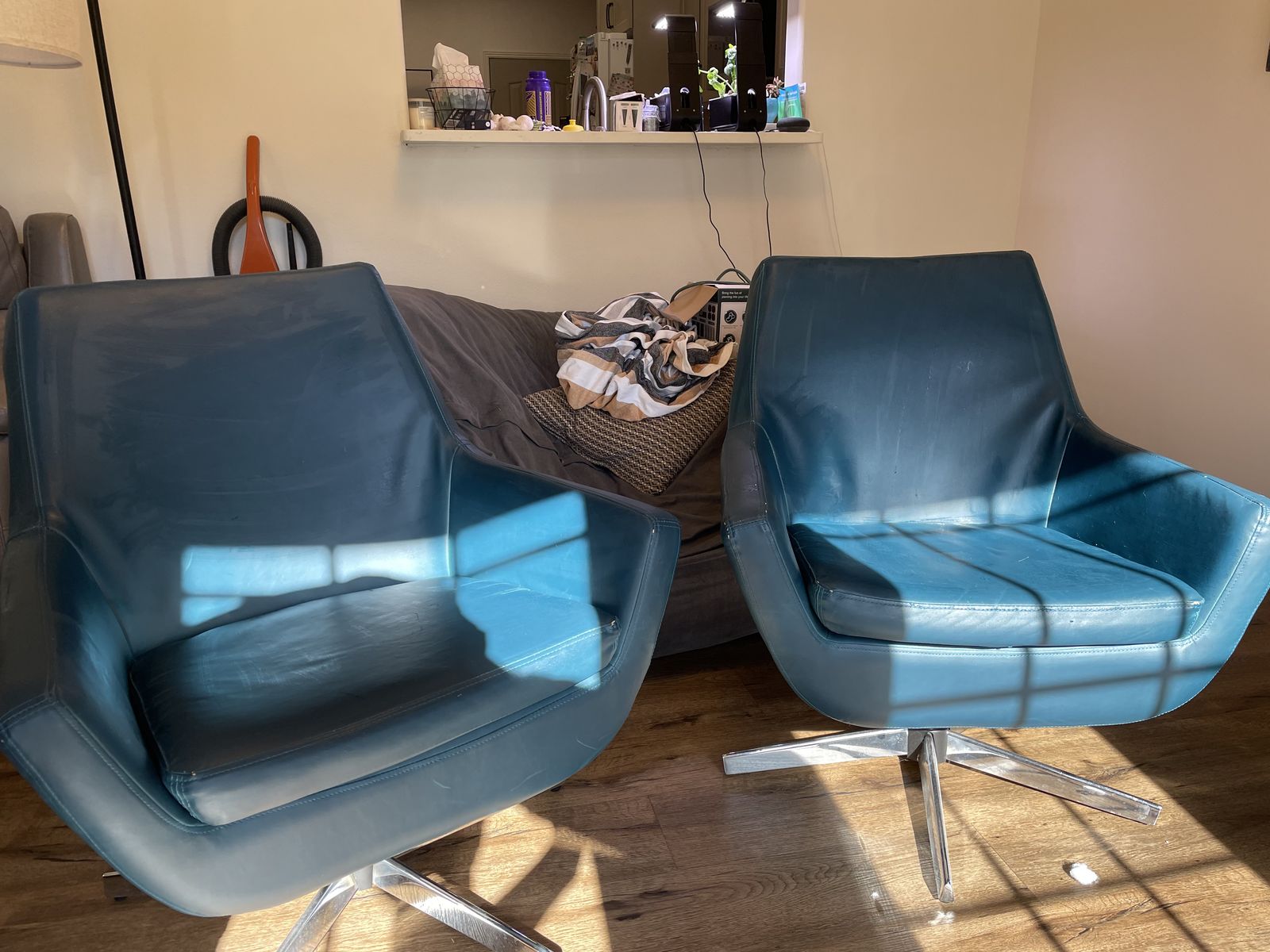2x Blue Leather Swivel Chairs