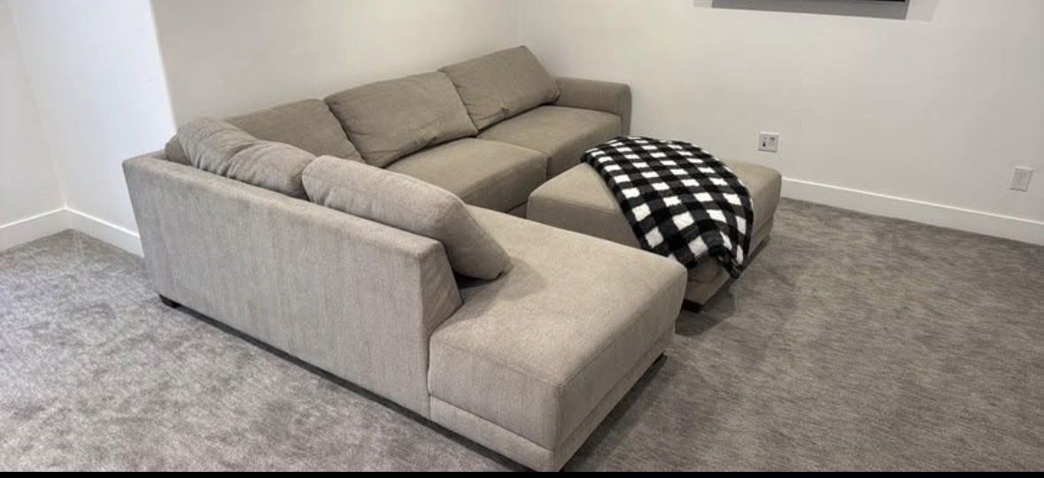 Spacious Beige Fabric Sectional Sofa with Ottoman - Excellent Condition