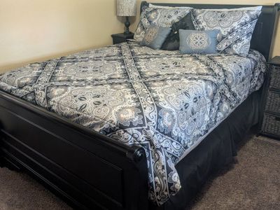 Dark Wood Sleigh Queen Bed Frame - Headboard, Footboard, Rails, Slats and clean mattress set.