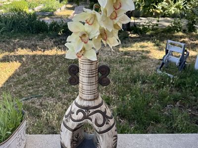 A decorative ceramic vase with a Southwest or boho-style design, 24” tall.