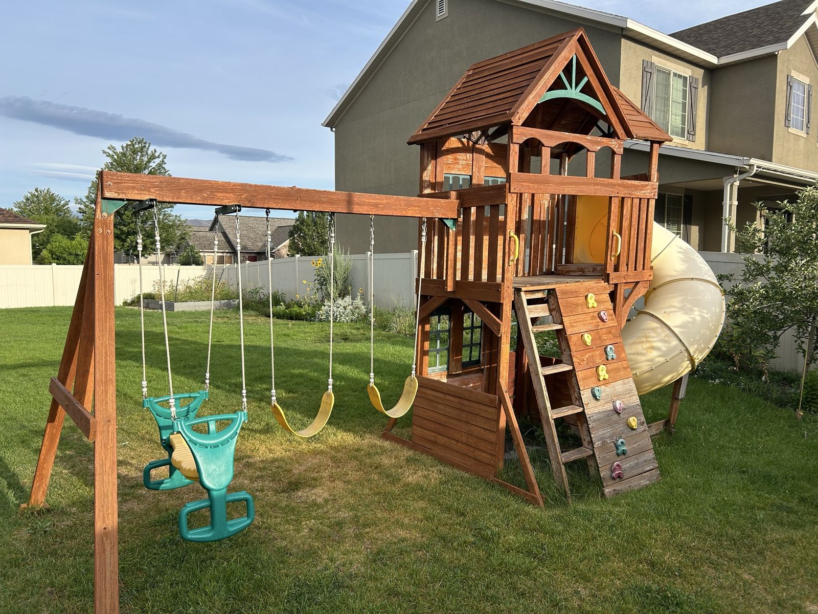 Free Wooden Backyard Playset with Clubhouse, Swings, Slide, and Rock Climbing Wall