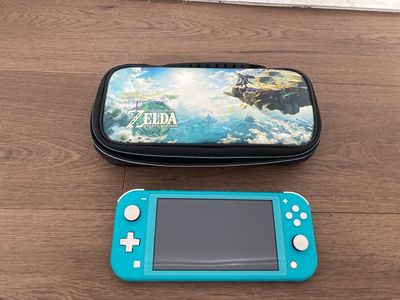 NINTENDO SWITCH LITE, TEAL BLUE WITH ZELDA SOFT CASE #WCP038122