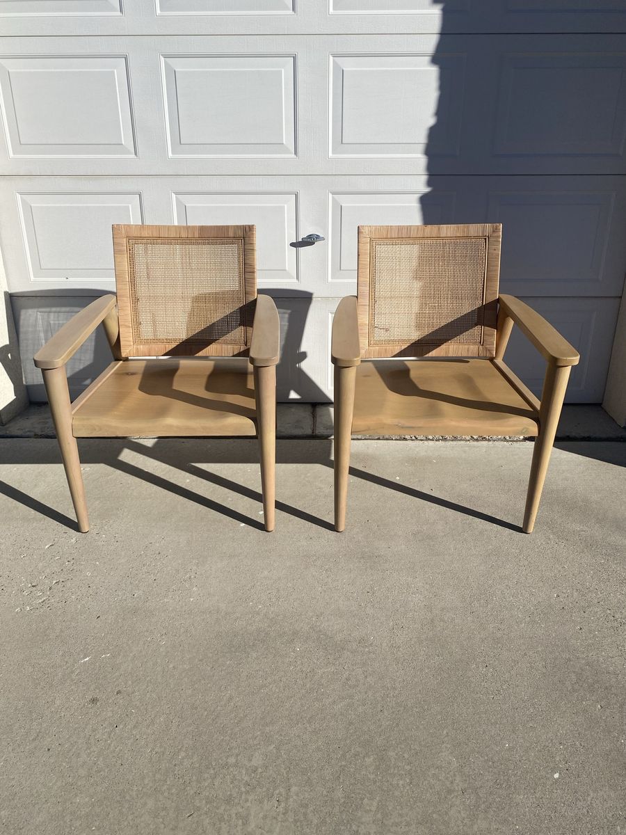 Two wood and cane accent chairs