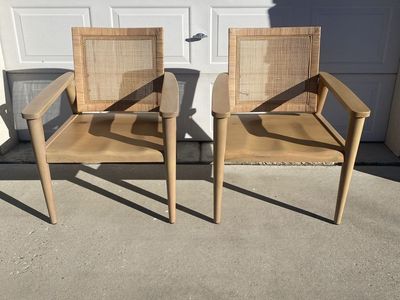 Two wood and cane accent chairs