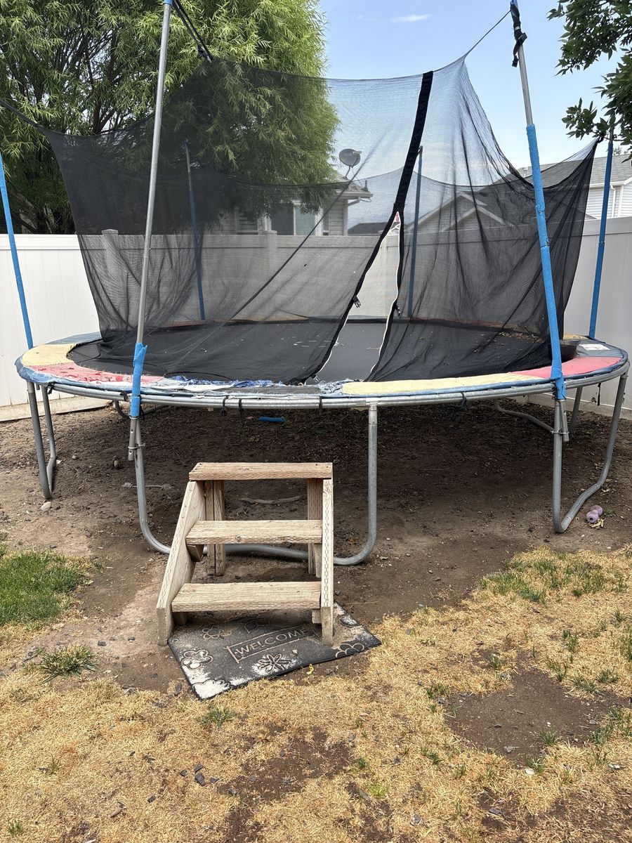 Used Outdoor Trampoline with Safety Enclosure Net and Wooden Steps - As-Is Condition