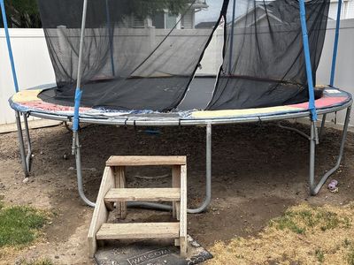 Used Outdoor Trampoline with Safety Enclosure Net and Wooden Steps - As-Is Condition