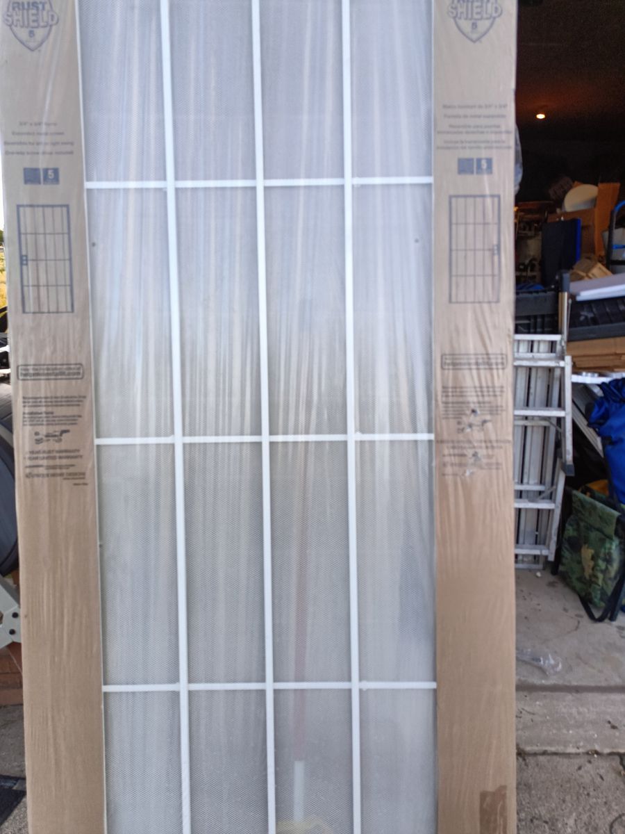 New 36 inch metal security screen door, white.