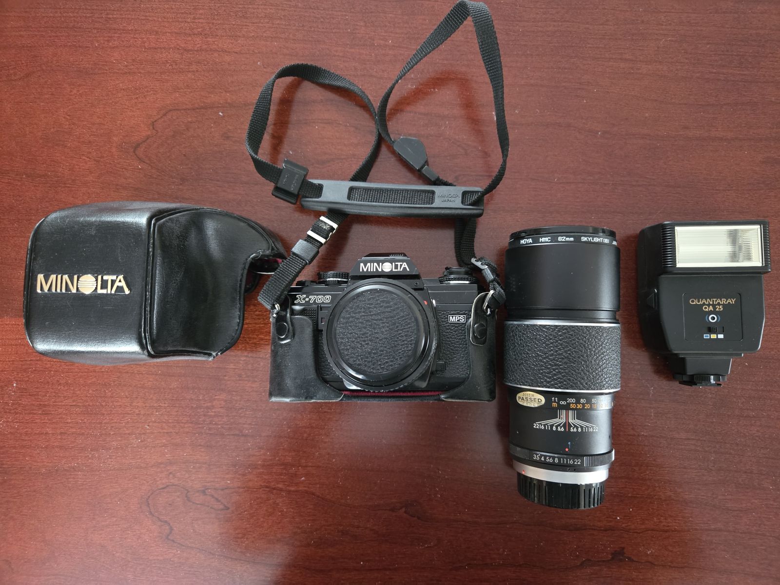 Minolta x-700 35mm camera    and Hoya 62mm extedned lens Flash and case included