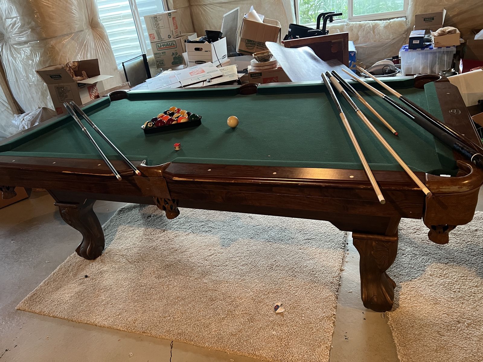 Pool table with pool sticks