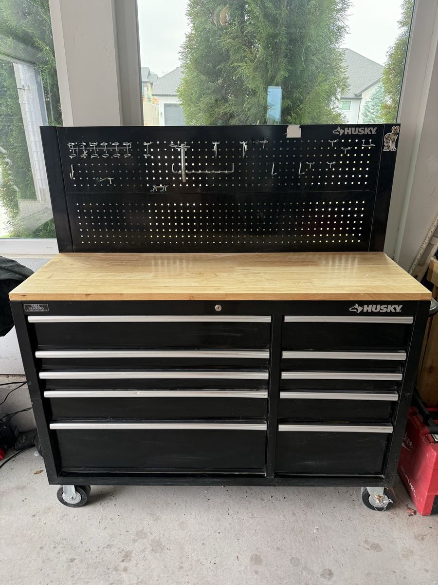 Husky 52-inch 9-Drawer Black Mobile Workbench Toolbox with Solid Wood Top and Pegboard