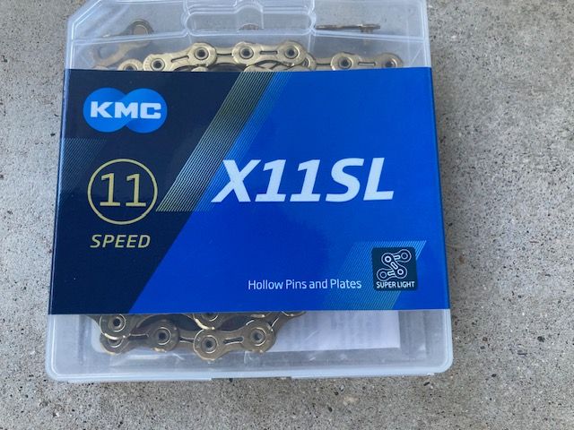 Brand New - 11 sp bike chain - KMC - Gold