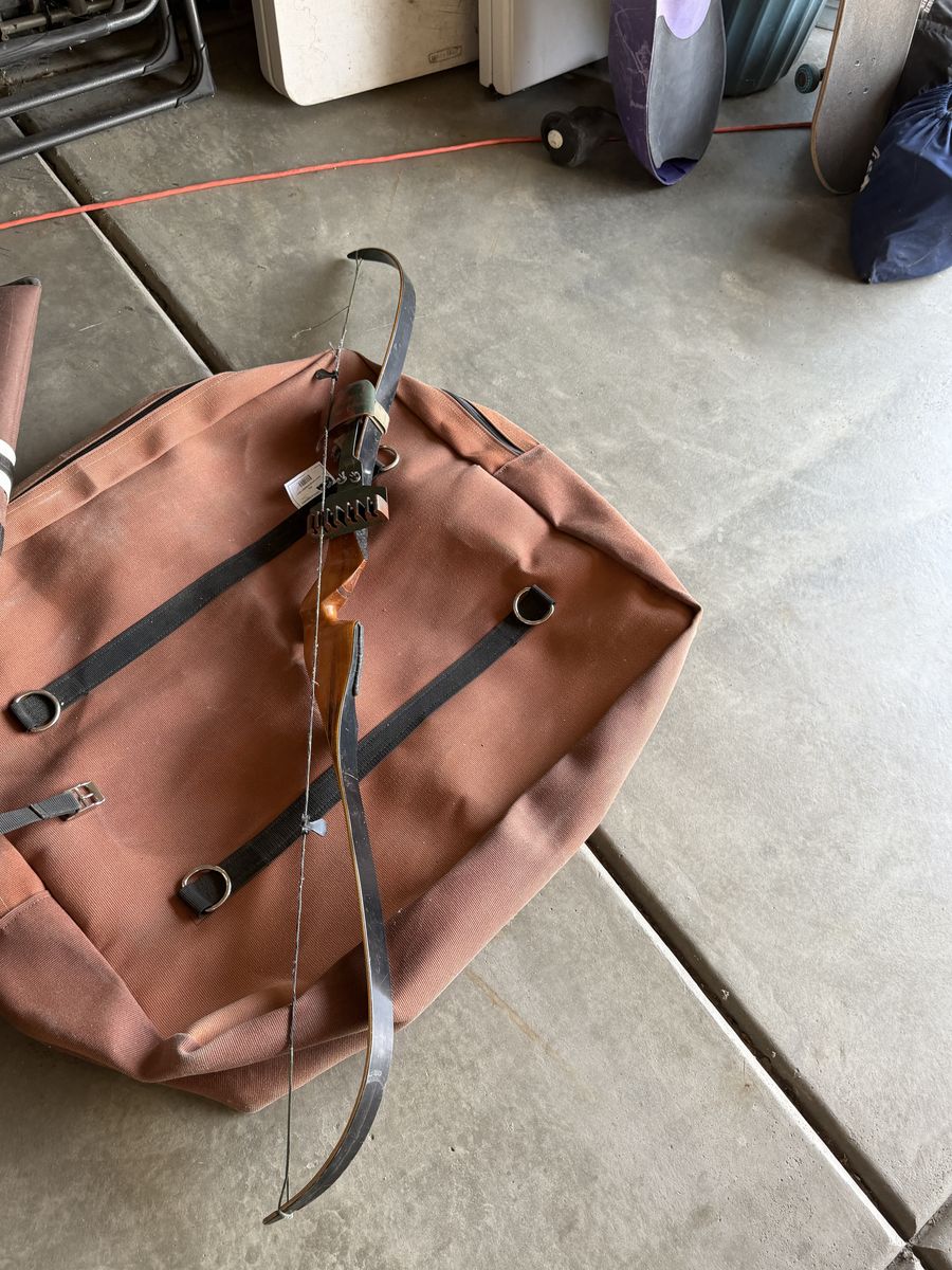 Pack topper and hand made recurve bow.