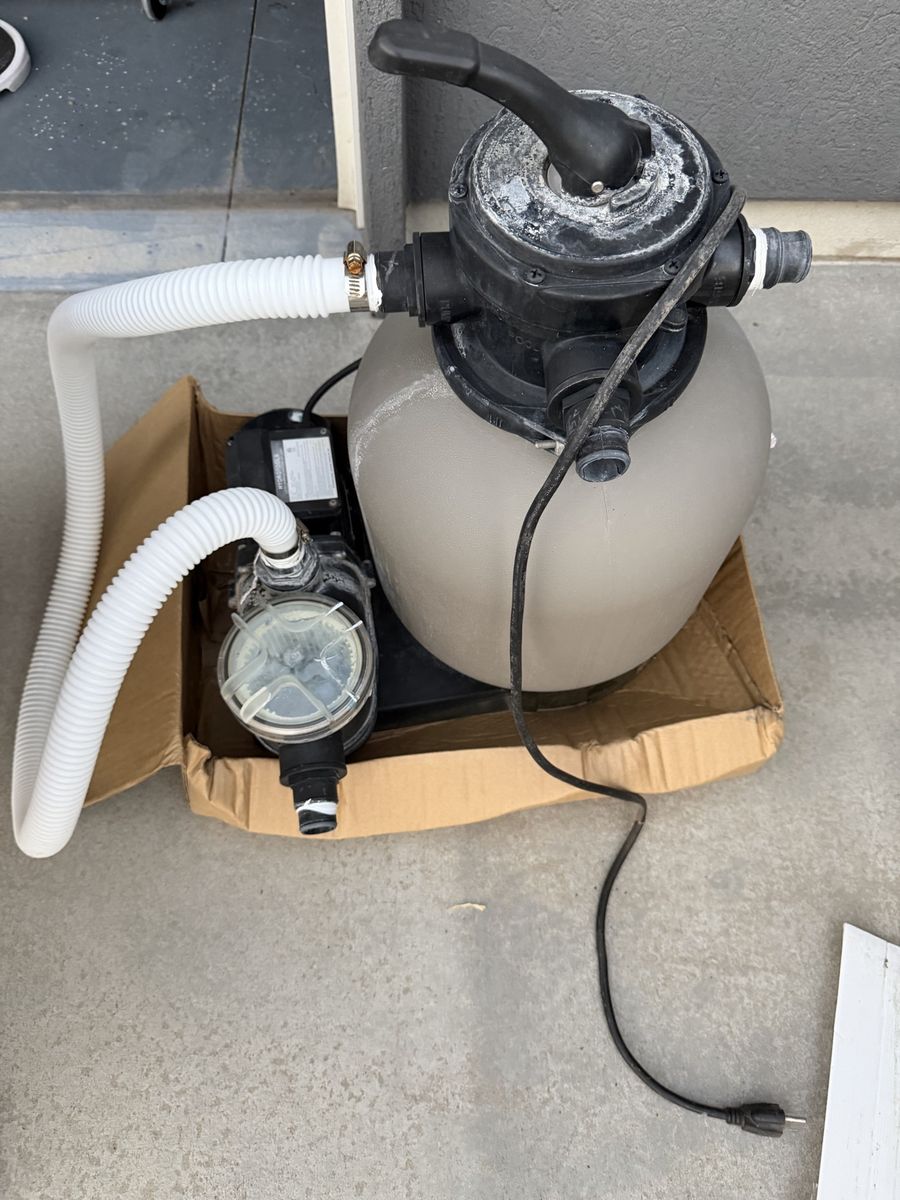 Hydrotools above ground pool pump and sand filter.