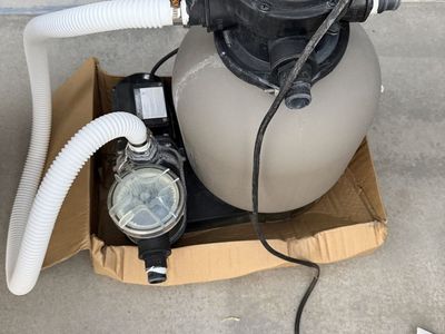 Hydrotools above ground pool pump and sand filter.