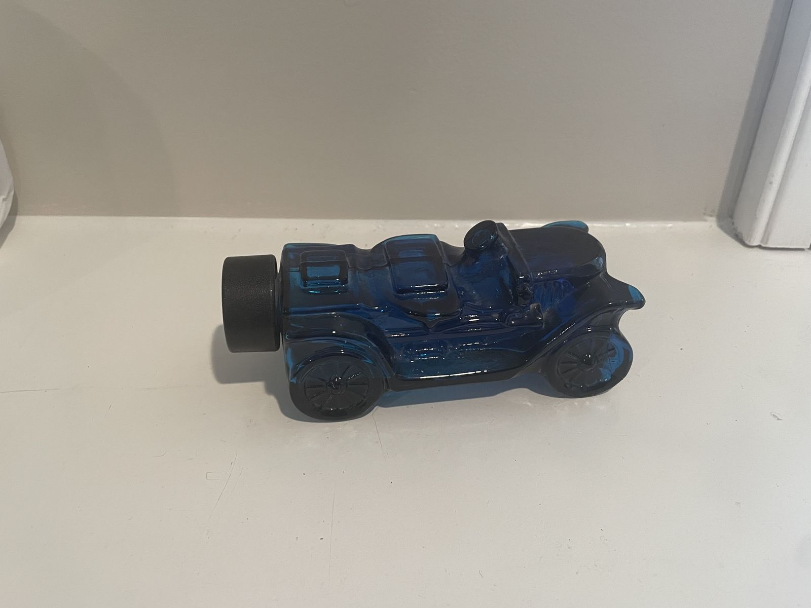 Avon race car shaped blue glass aftershave bottle