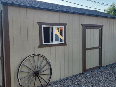 Spacious Outdoor Storage Shed - Tan with Brown Trim & Double Doors