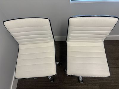Pair of White Faux Leather Office Chairs with Chrome Base and Adjustable Height