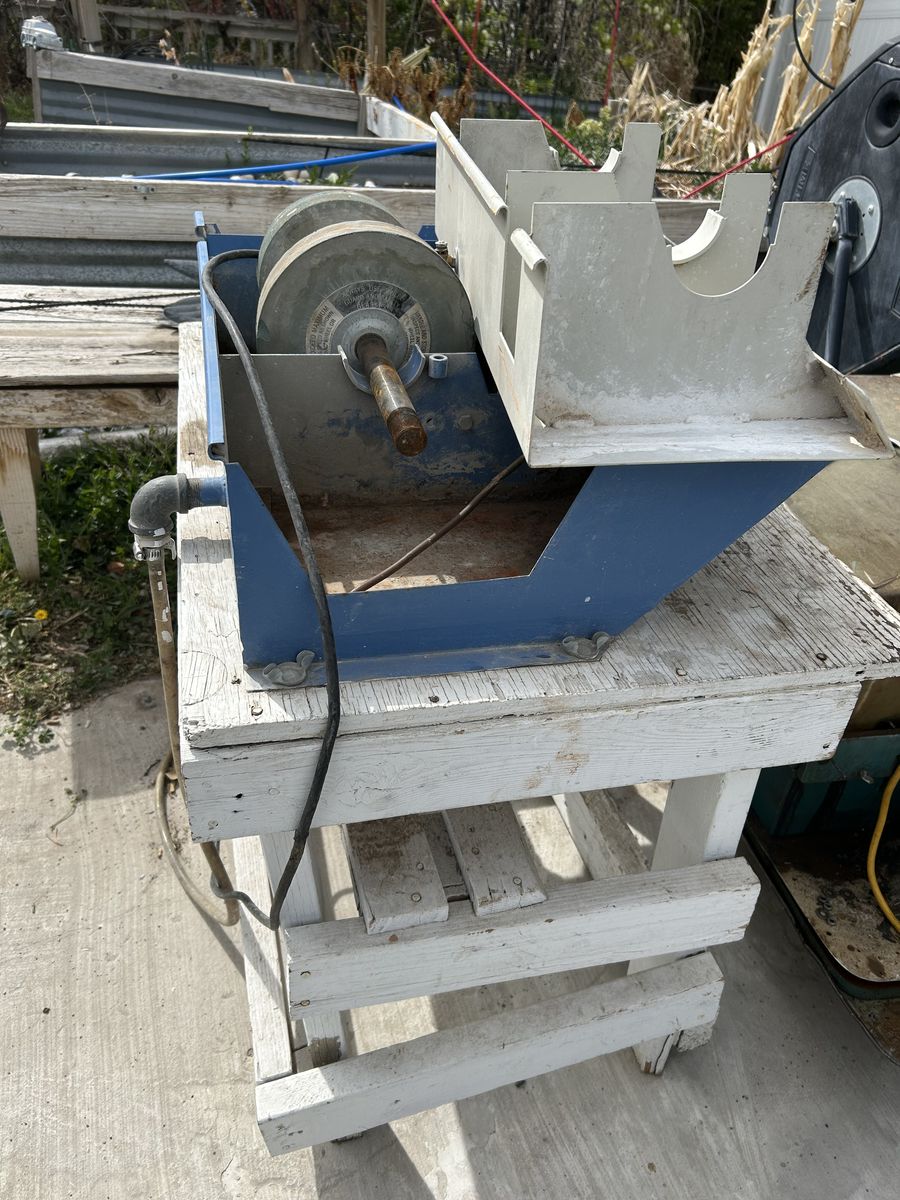 Lapidary cabbing machine.