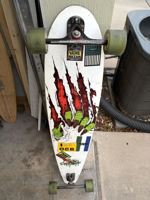 The Never Summer Longboard Skateboard with Green Wheels - Used Condition
