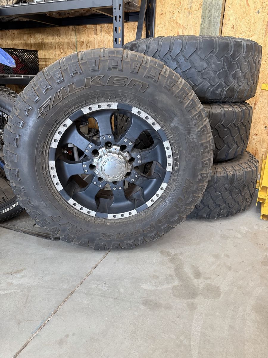 Falken Wildpeak 35x12.50R18LT All-Terrain Tires w/ Black & Silver Wheels (4)
