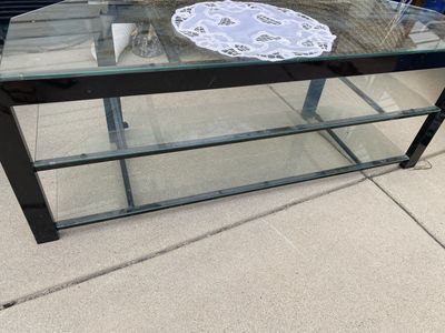 Glass and metal nice TV stand $20 (we can deliver for a fee depending on the area.