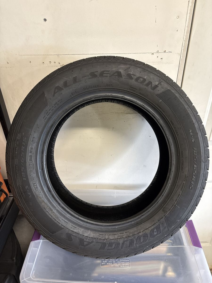 Douglas All-Season Tire 185/65R15.  New/Never used. 