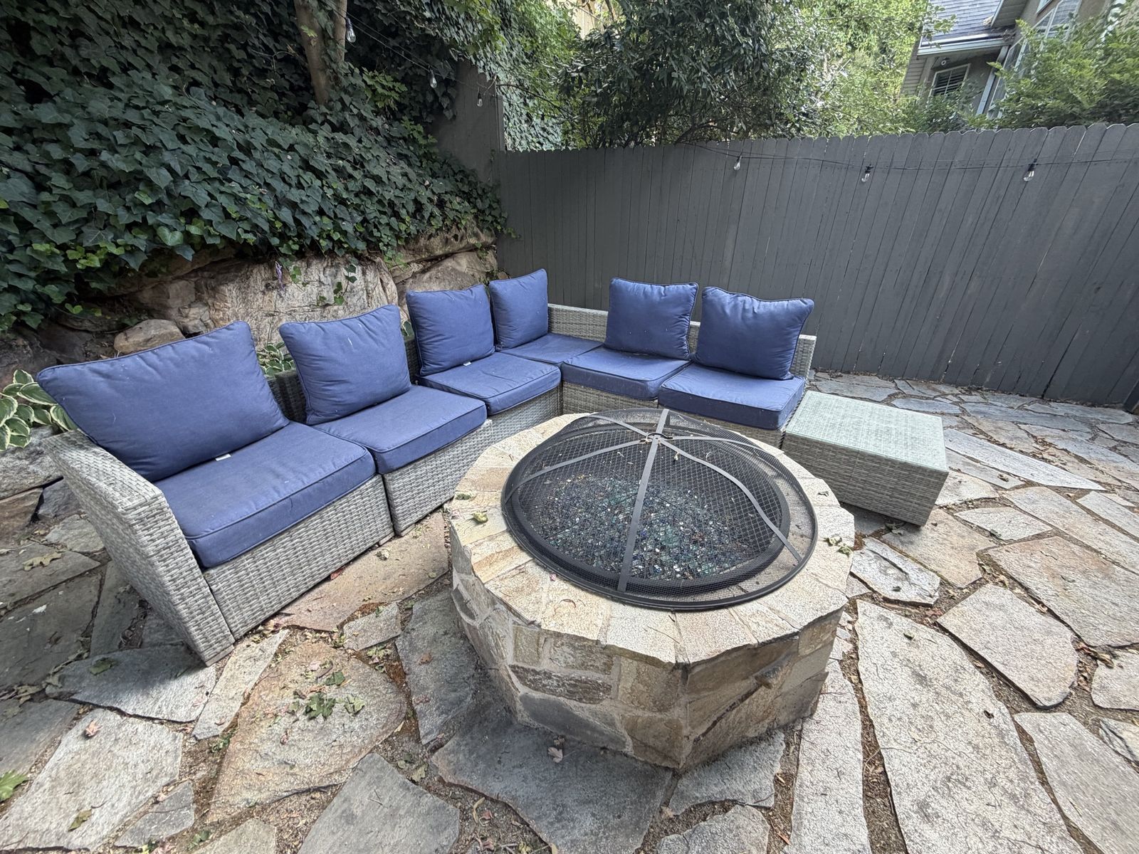Grey wicker sectional with upgraded cushions.