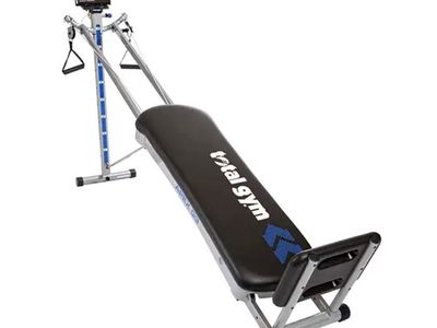 Used Like New Total Gym with multiple accessories